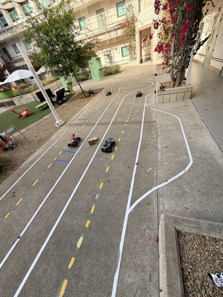 The outdoor course at UC San Diego with several small autonomous cars on it